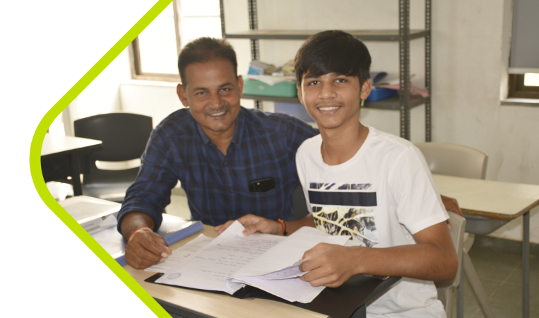 A boy counselling with male teacher at anand niketan school