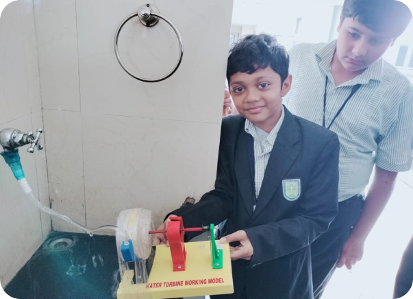 Students hold the water turbine working model